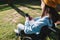 Disabled girl in a wheelchair using her mobile phone