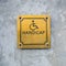 Disabled Handicap Icon and wording Handicap Sign made from gold