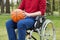Disabled holding a basketball ball