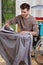 Disabled ironing shirts on board