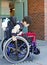 Disabled kindergartner in wheelchair on playground at recess