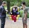 Disabled little boy swinging in handicap swing