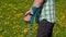 Disabled man with crutches on the dandelion field