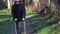 Disabled man on crutches at outdoor near benches in park