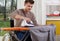 Disabled man during ironing