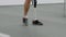 Disabled man with leg prosthesis walking at adaptive sport competition: close up