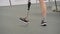 Disabled man with leg prosthesis walking at adaptive sport competition: close up