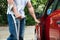 Disabled man opening door of a car