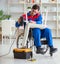 Disabled man repairing chair in workshop