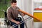 Disabled man setting up an iron board