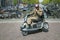 disabled man stunts on scoot mobile on bridge in centre on amsterdam