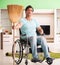 Disabled man on wheelchair cleaning house