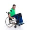 Disabled man in a wheelchair is doing sport with ball