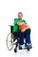 Disabled man in a wheelchair is doing sport with ball