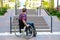 Disabled man in wheelchair in front of stairs