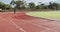 Disabled mixed race man with prosthetic legs running on race track