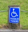 A disabled parking only sign on the street side, for providing c