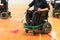 Disabled People on an electric wheelchair playing sports, powerchair hockey. IWAS - International wheelchair and amputee