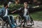 Disabled People on Wheelchairs Have Fun in Park.