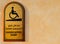 A disabled plaque in Arabic and English at the entrance to the Mosque