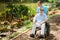 Disabled Senior Enjoying Garden