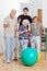 Disabled Senior People With Trainer Showing Thumbs