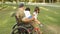 Disabled soldier dad playing with kids in park