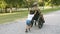 Disabled soldier walking with kids in park