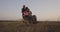 Disabled soldier watching sunset with family