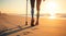 A disabled sportswoman with prosthetic legs walks outdoors on a sandy beach along the seashore