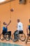 Disabled War veterans mixed race and age basketball teams in wheelchairs playing a training match in a sports gym hall