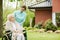 Disabled woman with caregiver in the garden of the nursing home