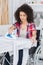 Disabled woman doing ironing