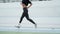 Disabled woman jogging on running track. Athlete legs running at sports avenue