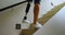 Disabled woman with prosthetic leg moving upstairs 4k