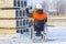 Disabled worker on wheelchair take photos on tablet in construction site