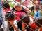 Disadvantaged Woman and Kids Behind the Fence Stock Photo