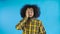 Disappointed afro american male doing facepalm gesture against Blue background. Concept of emotions