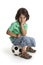 Disappointed little boy sitting on a soccer ball