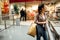 Disappointed shoppingholic woman in shopping mall.Buying in designer store.Wardrobe shopping.Hoby buyer.Weakness for clothes.Image