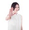 A disappointed and unpleased brunette girl with a stop gesture, isolated on a white background. A sad office lady.