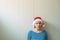 Disappointed woman with Christmas Santa Claus hat