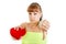 Disappointed young woman sadly holding heart showing thumb down