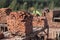 disassemble red concrete bricks. scattered stone pavement bricks texture.