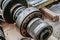 Disassembled gear wheels of a metalworking machine being repaired in a workshop