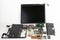 Disassembled laptop, basic components of notebook, screen, keyboard, processor, motherboard, internal  hard disk drive, CPU fan