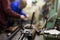 Disassembled shotgun on worktable of gunsmith in weapons workshop