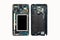 Disassembled used smartphone mobile phone isolated