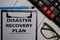 Disaster Recovery Plan write on a paperwork isolated on office desk