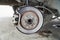 Disc brake of the vehicle for repair,Seal a leaking car tire.Car brake repairing in garage